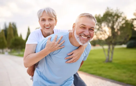 Couple laughing outdoors