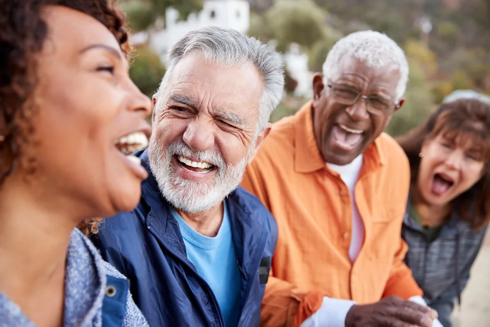 Older friends laughing together
